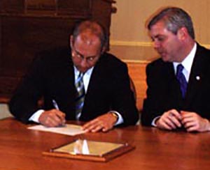Chairman Michael Tikoian signs the letter