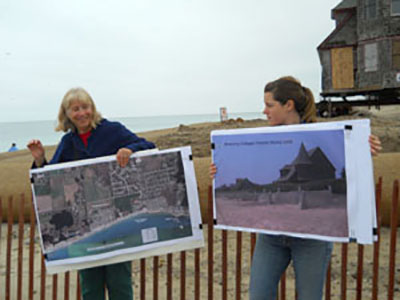 Janet and Michelle show pictures of the historic Browning Cottages, two of which were demolished after Sandy, and rates of shoreline change and erosion in the area on aerial maps. The red-trimmed house in the background is being elevated and moved away from the encroaching waves.