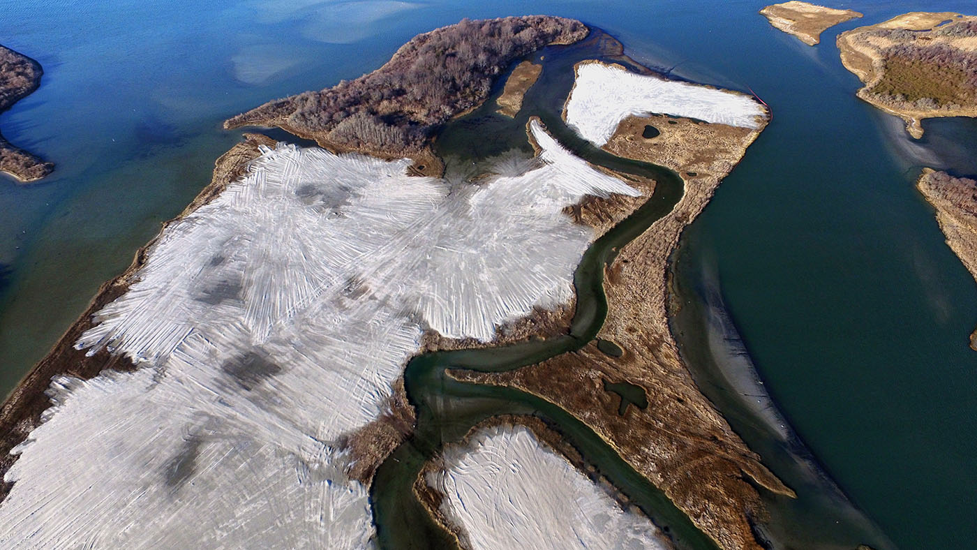 An aerial photo taken of the Ninigret salt marsh immediately after the elevation enhancement work was completed