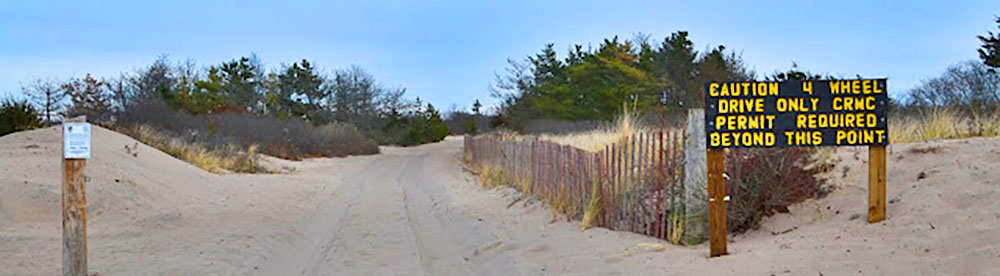 Beach trail with signage about requiring four wheel drive vehicles
