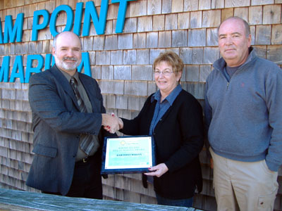 CRMC Deputy Director Jeff Willis congratulates Ram Point Marina