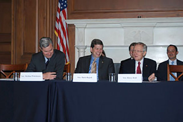 Senator Whitehouse and Senator Begich listen to Majority Leader Reid at the start of today’s meeting