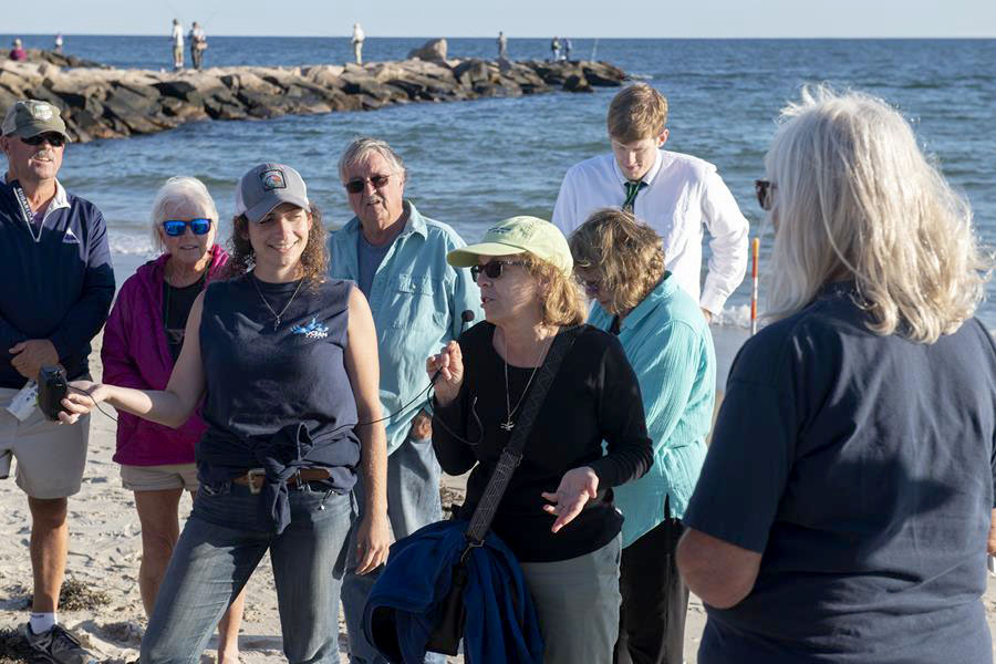 Representative Cortvriend discusses her lateral shoreline access bill at a public shoreline access event in Westerly in 2022